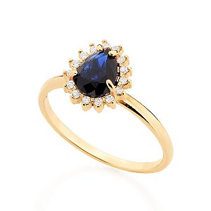 Anel Rommanel Liso Com Parte Superior No Formato Gota Tendo Cristal Facetado De 6X8Mm No Centro E 15 Zircônias De 1,25Mm