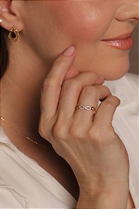 ANEL INFINITO VAZADO ZIRCÔNIA OURO 18K. OBS NÚMERAÇÃO DISPONIVEÍS ATÉ 24.