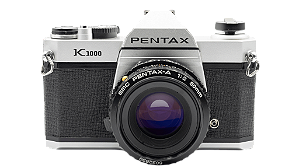 Câmera 35mm - Pentax K1000 + Lente 50mm f/2.0 + filme (na caixa)