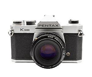 Câmera 35mm - Pentax K1000 (6.5/10) + Lentes 50mm f/2 (8.0/10) e 135mm f/3.5 (7.0/10) + Filme + Alça