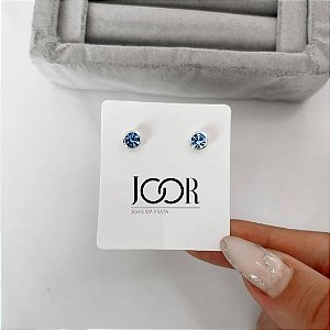 Brinco zircônia redonda embutida azul 6mm