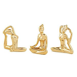 Escultura yoga dourada