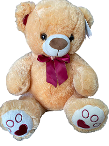Urso com laço vermelho