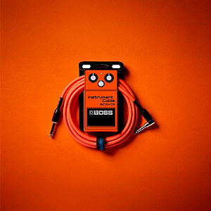 Cabo Boss Para Instrumento P10 x P10 L de 3m Laranja