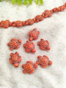 Tartaruga passante Howlita Laranja 15mm, furo 1 mm (un)