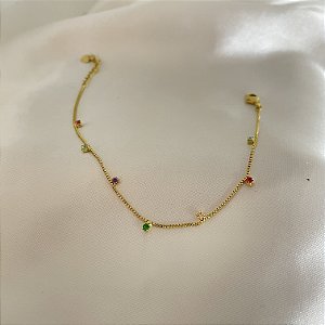 Pulseira fina com pequenas pedras de zircônia colorida banhado em ouro 18k