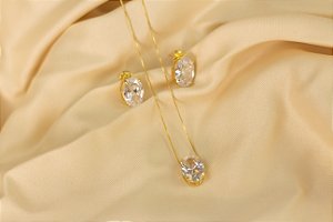 Conjunto dourado com pedra em zircônia oval