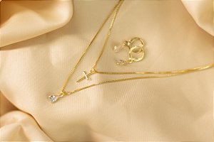Conjunto cruz e zircônia