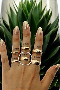 Par de Alianças pesando 16 gramas de Ouro Amarelo 18k. com 6mm de largura.
