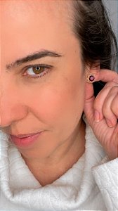 Ponto de luz dourado com bolinhas em volta do strass ametist