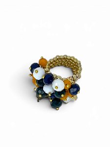 Anel de bolinha dourada com cristais verde, amarelo, azul e branco