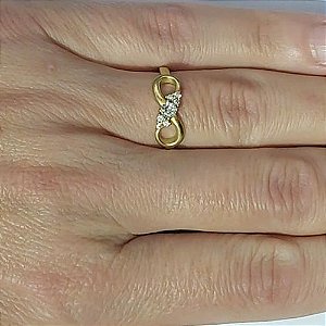 ANEL NO BRUTO PRONTO PARA O BANHO(CX111) - ANEL COM  PEDRA DE ZIRCÔNIA FORMATO INFINITO - PESO MEDIO 2,9GR - COMPOSIÇÃO: LATÃO / ZIRCÔNIA - ANEL000404