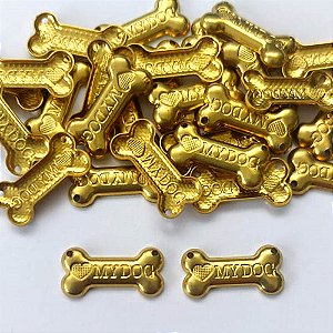 ACESSÓRIO NO BRUTO PRONTO PARA O BANHO - (2558) OSSO MY DOG 18MM COM DOIS FUROS - PESO TOTAL 0,8GR - COMPOSIÇÃO: 100% LATÃO - BRU0003403