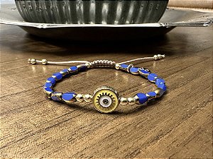 Pulseira Cristais Facetados Azul com Olho Grego Amarelo
