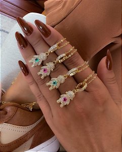 Pingente menino cravejado dourado com fecho click