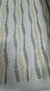 Tule bordado com pedrarias,cinza,off e creme  130 cm composição 100% Poliamida.