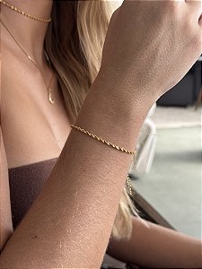 Pulseira torcidinha • folheado a ouro