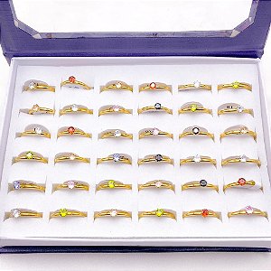 CAIXA ANEL SOLITÁRIO ACO INOXIDAVEL 2MM PEDRAS COLORIDAS - DOURADO (36 UNIDADES)