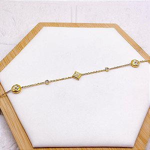 PULSEIRA AÇO INOX TREVO PEROLADO COM PEDRA CRISTAL - DOURADA