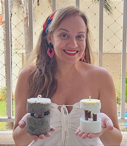 Vela aromática de base de concreto suspensa no pau de canela