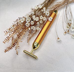 Massageador Facial Dourado Vibratório