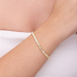Pulseira rivieira em baguete com zircônia cristal folheada a ouro