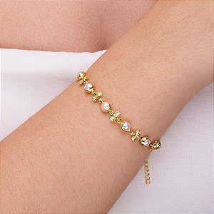 Pulseira perola com entremeio de laço