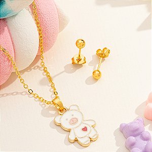 Conjunto infantil com pingente de urso branco e brinco de bolinha folheado a ouro.
