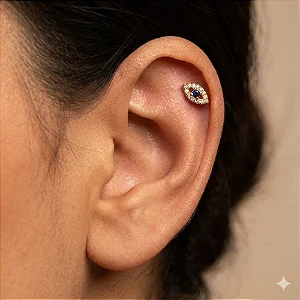 PIERCING OLHO GREGO