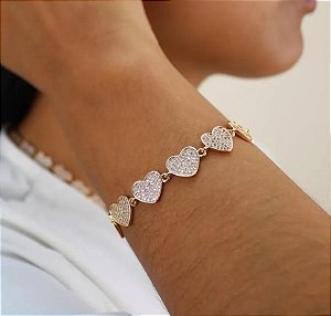 PULSEIRA DOURADA CORAÇÕES CRAVEJADOS