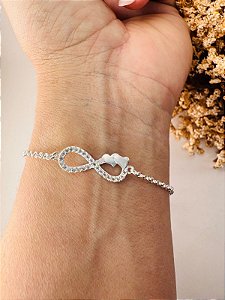 Pulseira infinito cravejado com 2 corações lisos