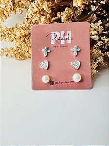 Brinco trio pérola, coração cravejado, cruz com ponto de luz