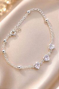 PULSEIRA COM 3 CORAÇÕES ZIRC E DET EM ESFERINHAS