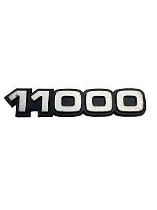 Emblema 11000 do Para-Lama Dianteiro do GM Caminhão 11000 de 1985 a 1990 Original GM 94654770 Novo de Época