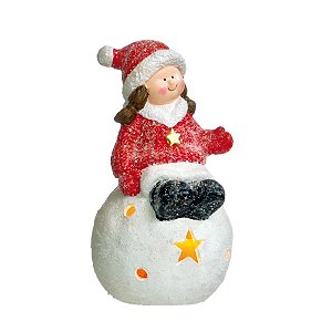 Menina Sentado na Bola de Led Vermelho e Branco