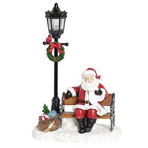 Noel no Banco ao Lado do Poste Colorido