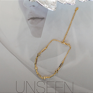 Pulseira cruz com ponto de luz