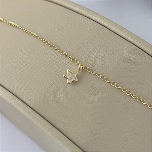 Tornozeleira em banho de ouro 18k com pingente de estrela em zircônia