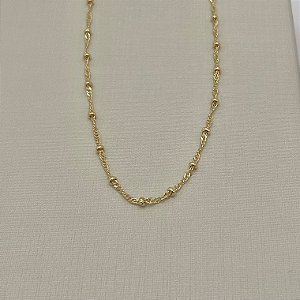 Tornozeleira em banho de ouro 18k em malha fina com bolinhas