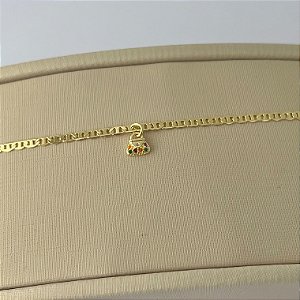Pulseira infantil de bolsa cravejada em banho de ouro 18k