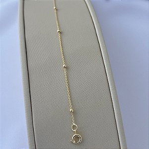 Pulseira infantil de mini bolinhas lisas em banho de ouro 18k