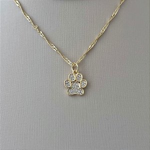 Colar pata de cachorro cravejada em banho de ouro 18k