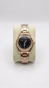 Relógio Feminino Dourado Com Pedras Que Se Movem Fundo Preto