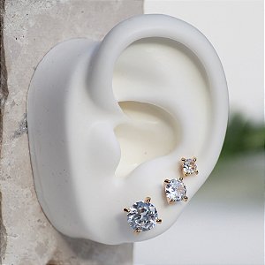 Trio de pontos de luz dourado