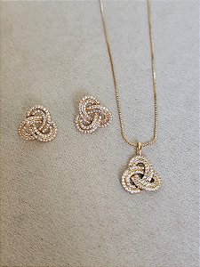 Conjunto entrelaçado zircônia dourado