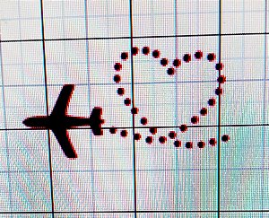 Avião com caminho formato coração filme termocolante