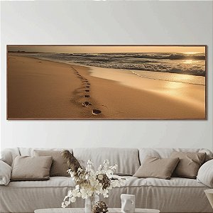 Quadro decorativo Praia ensolarado com pegadas na areia.