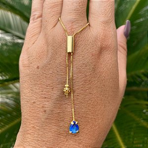 COLAR GRAVATINHA DOURADA COM GOTA NA COR AZUL .