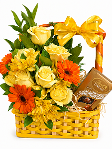 Arranjo de gérberas, rosas amarelas e chocolates