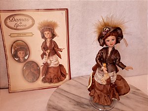 Boneca de porcelana articulada,  Jane Eyre, com revista, coleção damas de época , de Agostini  com.base colada com cola quente